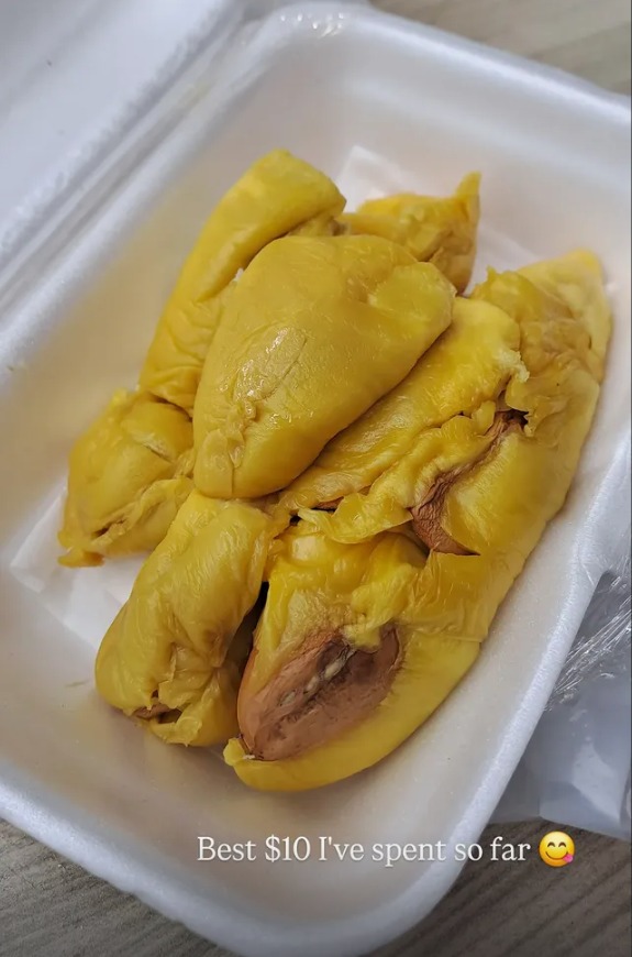 A takeaway box of golden durian flesh