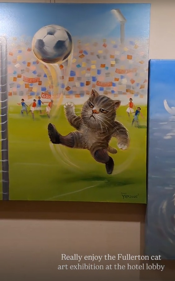 A painting of a cat kicking a football