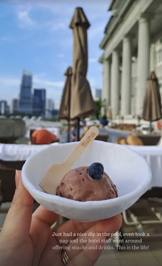 A scoop of chocolate ice cream by the pool
