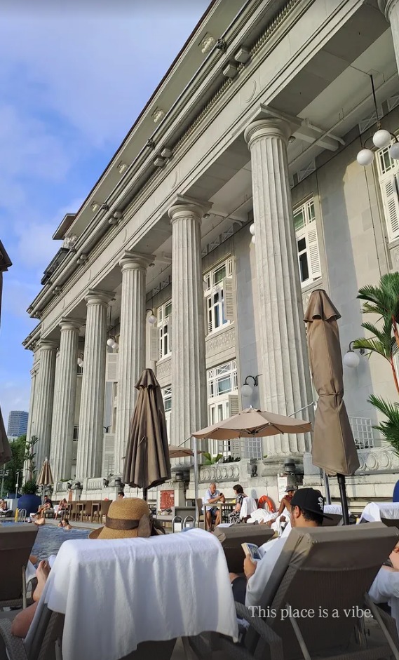 Sun loungers beside the hotel's grand columns