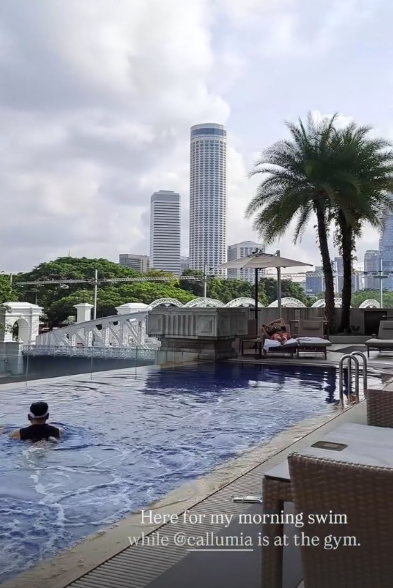 The pool with palm trees and the river bridge