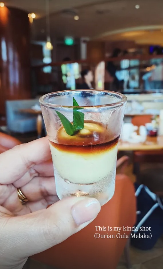 A shot glass of durian gula melaka dessert