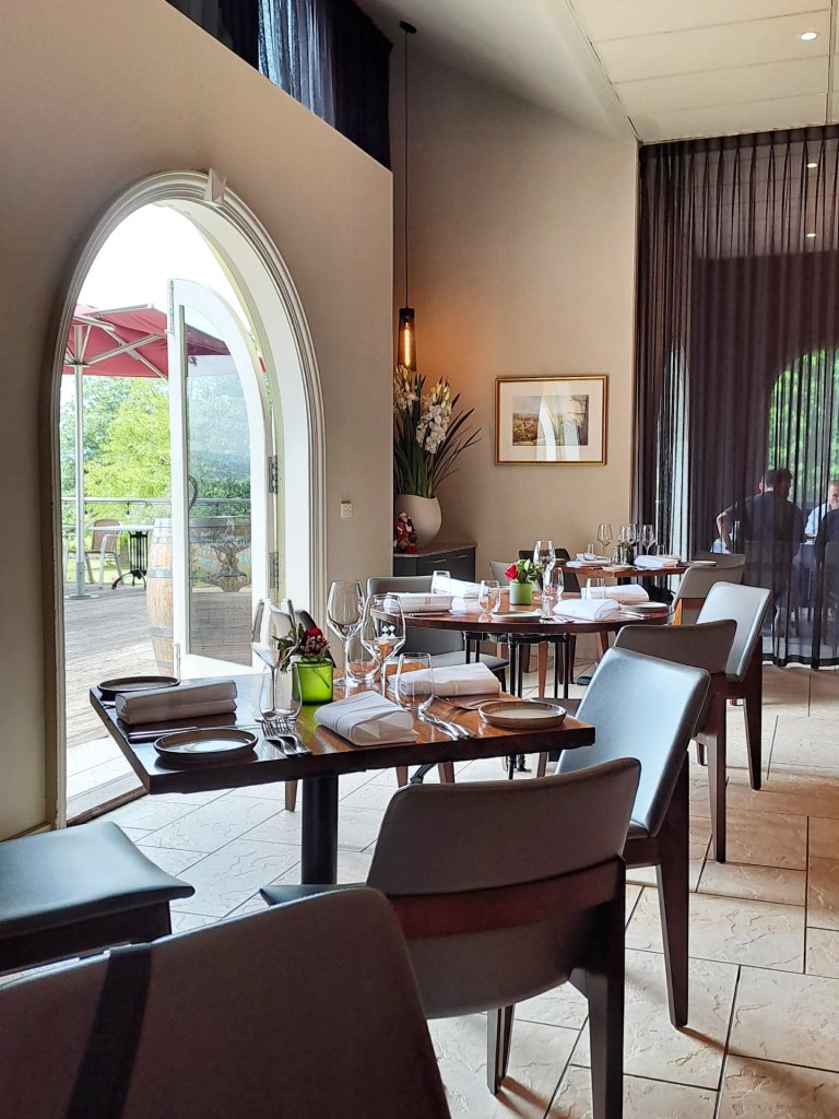 The light-filled dining room with an arched doorway