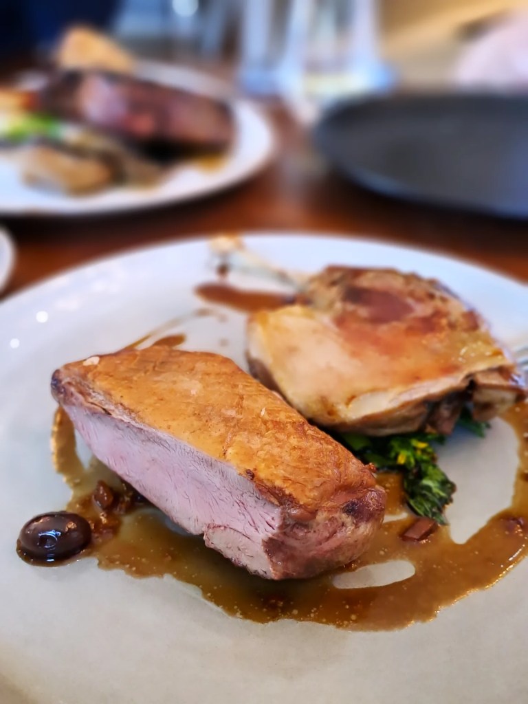 Duck breast and leg with a glossy jus