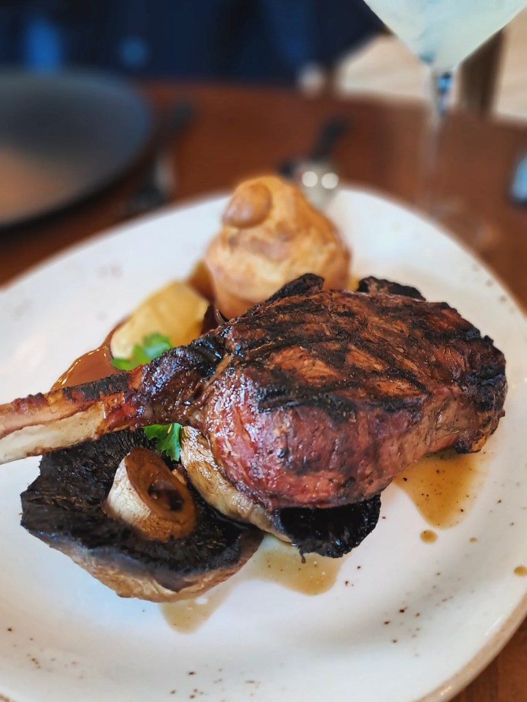 A chargrilled bone-in steak with Yorkshire pudding