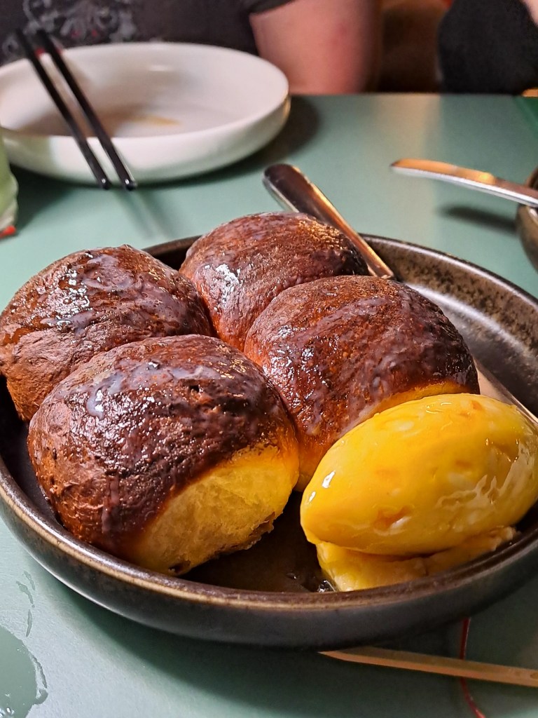 Fluffy milk buns with butter at Yum Sing House